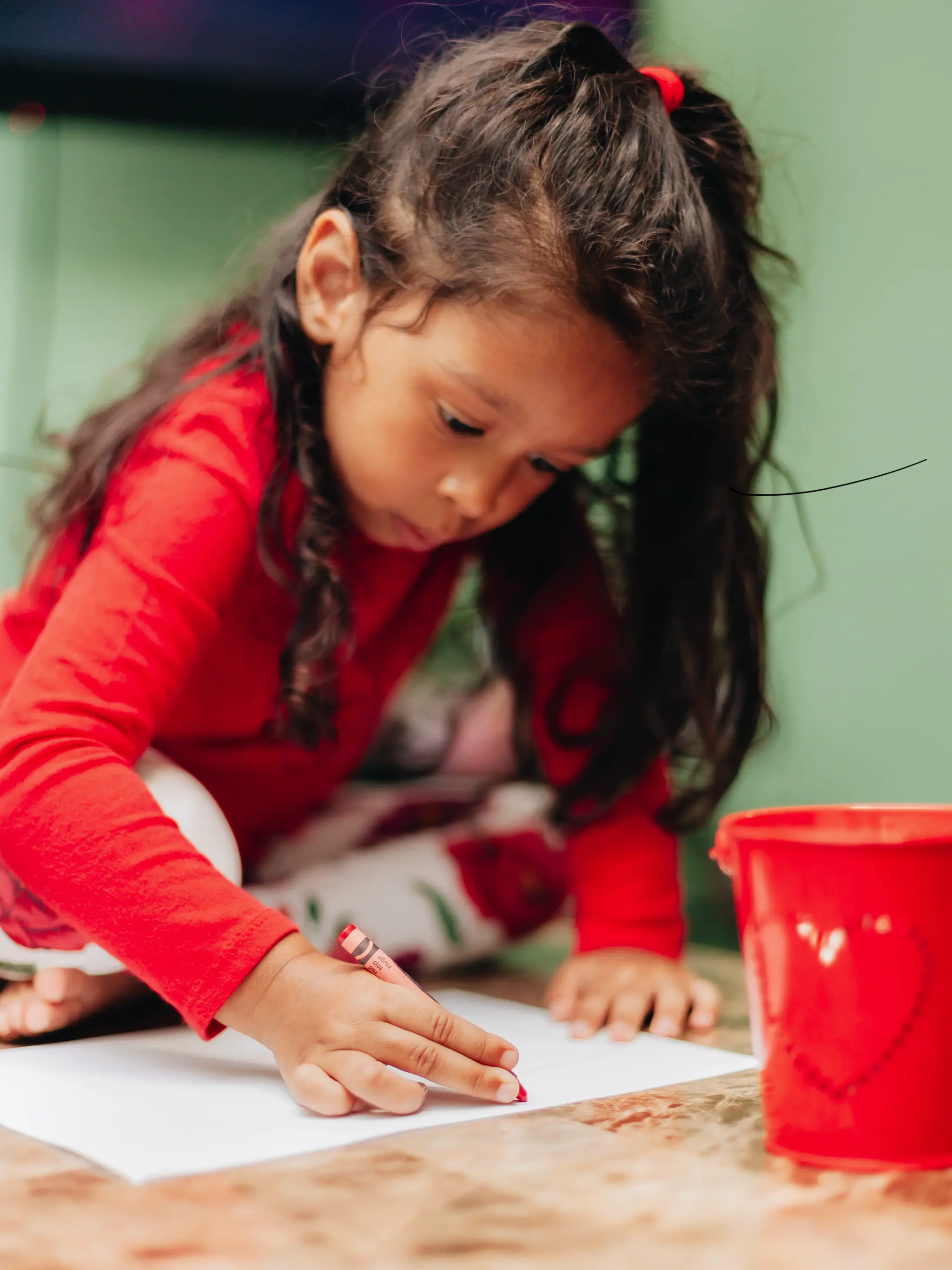 A child drawing their dream car